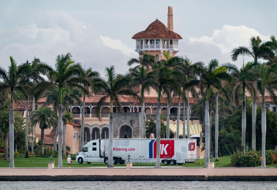 A moving truck is parked outside Mar-a-Lago on Monday. Donald Trump is expected to return on Wednesday.