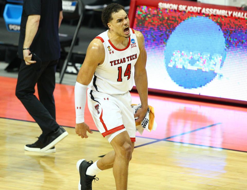 Mar 19, 2021; Bloomington, Indiana, USA; Texas Tech Red Raiders forward Marcus Santos-Silva (14) reacts after a basket scored against the Utah State Aggies during the second half in the first round of the 2021 NCAA Tournament at Simon Skjodt Assembly Hall.