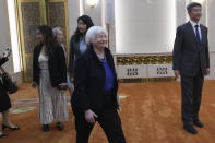 U.S. Treasury Secretary Janet Yellen, foreground, arrives for a meeting with Chinese Premier Li Qiang, unseen, at the Great Hall of the People in Beijing, China, Sunday, April 7, 2024. Yellen, who arrived later in Beijing after starting her five-day visit in one of China's major industrial and export hubs, said the talks would create a structure to hear each other's views and try to address American concerns about manufacturing overcapacity in China. (AP Photo/Tatan Syuflana, Pool)