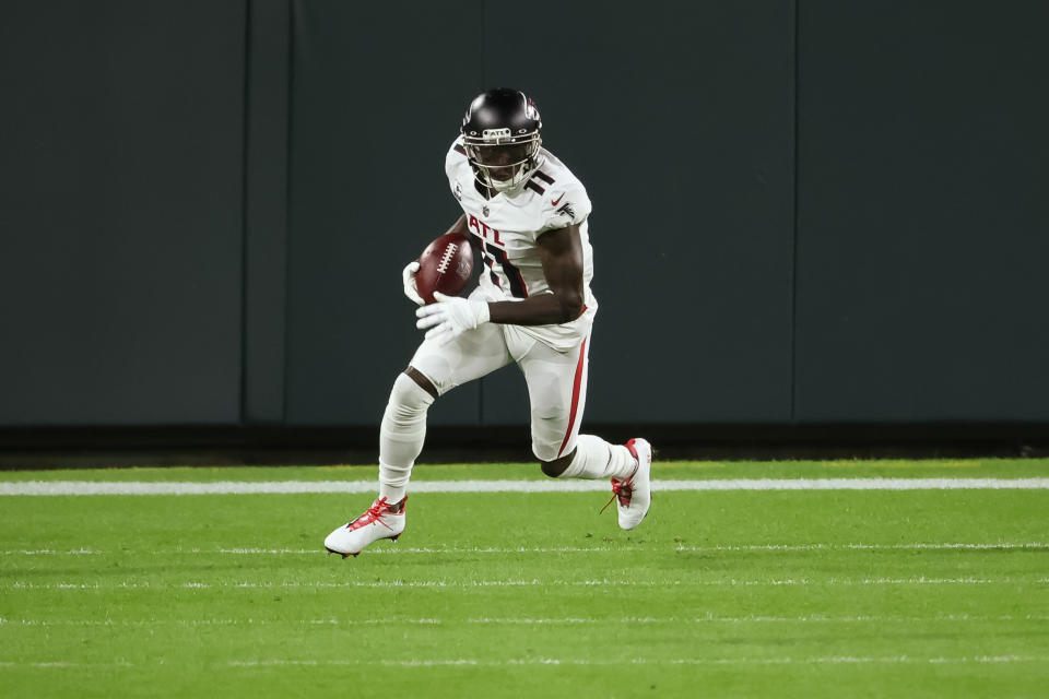 GREEN BAY, WISCONSIN - OCTOBER 05: Julio Jones #11 of the Atlanta Falcons runs with the ball in the first quarter against the Green Bay Packers at Lambeau Field on October 05, 2020 in Green Bay, Wisconsin. (Photo by Dylan Buell/Getty Images)