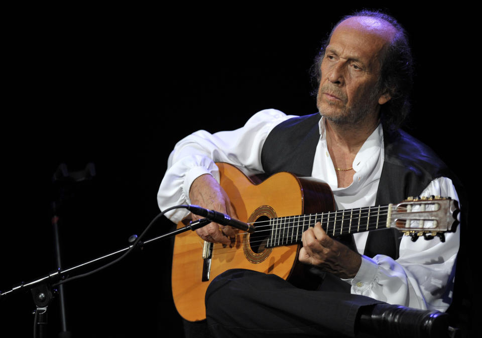 FILE - In this July 8, 2010 file photo, Spanish flamenco guitarist Paco de Lucia performs on the Miles Davis Hall stage at the 44th Montreux Jazz Festival, in Montreux, Switzerland. Spanish officials said Wednesday Feb. 26, 2014 that world-renowned flamenco guitarist Paco de Lucia has died. He was 66. Jose Ignacio Landaluce, mayor of de Lucia's native Spanish town of Algeciras said in a statement Wednesday the guitarist died in Mexico, where he lived.The cause of death was not immediately made known. De Lucia, whose real name was Francisco Sanchez Gomez, was recognized as one of the world's leading guitarists, dazzling audiences with his lightning-speed flamenco rhythms and finger work. (AP Photo/Keystone, Martial Trezzini, File)