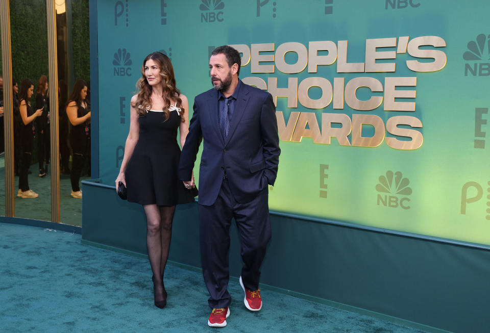 Jackie Sandler and Adam Sandler arrive to the 2024 People's Choice Awards held at Barker Hangar on February 18, 2024 in Santa Monica, California.  (Mark Von Holden / NBC via Getty Images)