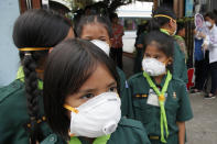 Thai students wear protective masks at Boonlert Anusorn school in Songkhla province, southern Thailand, Thursday, Sept. 19, 2019. Thailand's southernmost provinces, which are north of Malaysia halfway up the Malay Peninsula, were blanketed with haze from Indonesian forest fires on Thursday. (AP Photo/Sumeth Panpetch)