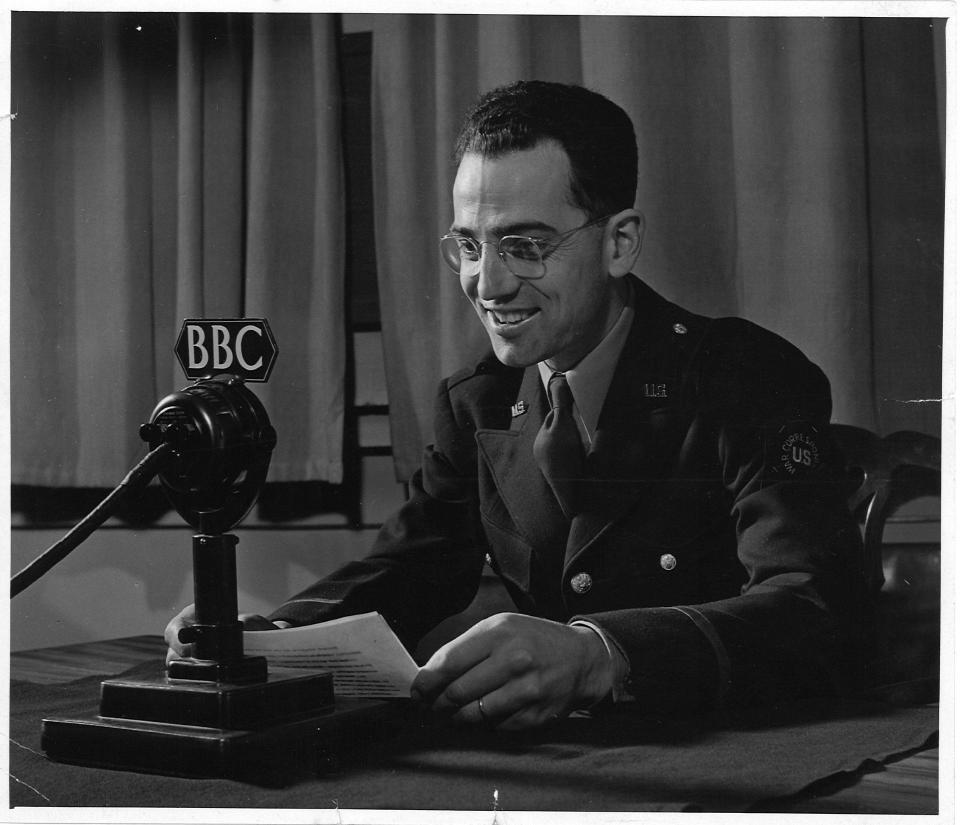 Herb Plambeck, a radio correspondent for WHO, is shown broadcasting the "Cornbelt Farm Hour" program for the station but from a British Broadcasting Corporation studio. Plambeck was also a war correspondent for WHO.