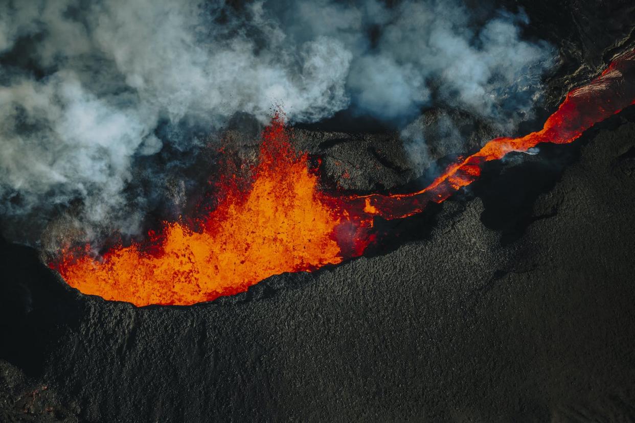 An aerial view of the Mauna Loa volcano, which erupted on the island of Hawaii in December 2022. <a href="https://www.gettyimages.com/detail/news-photo/in-an-aerial-view-lava-erupts-from-the-mauna-loa-volcano-on-news-photo/1245459430?phrase=Mauna%20Loa%20volcano%202022&adppopup=true" rel="nofollow noopener" target="_blank" data-ylk="slk:Andrew Richard Hara/Getty Images News;elm:context_link;itc:0;sec:content-canvas" class="link ">Andrew Richard Hara/Getty Images News</a>