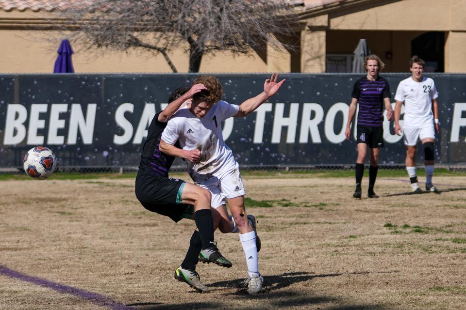 Northwest Christian School’s Keegan Young (3), left, and Thatcher High School’s Tate Oosterhouse (1), right, rush to the ball during the first half of the AIA 3A boys soccer quarterfinal game at Northwest Christian School in Phoenix on February 10, 2024. Northwest Christian School won 3-1.