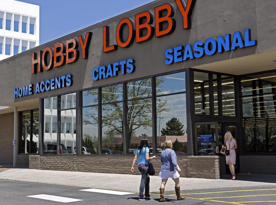 FILE - This May 22, 2013 file photo shows customer at a Hobby Lobby store in Denver. The Supreme Court has agreed to referee another dispute over President Barack Obama's health care law, whether businesses can use religious objections to escape a requirement to cover birth control for employees. The justices said Tuesday they will take up an issue that has divided the lower courts in the face of roughly 40 lawsuits from for-profit companies asking to be spared from having to cover some or all forms of contraception. The court will consider two cases. One involves Hobby Lobby Inc., an Oklahoma City-based arts and crafts chain with 13,000 full-time employees. Hobby Lobby won in the lower courts. (AP Photo/Ed Andrieski, File)