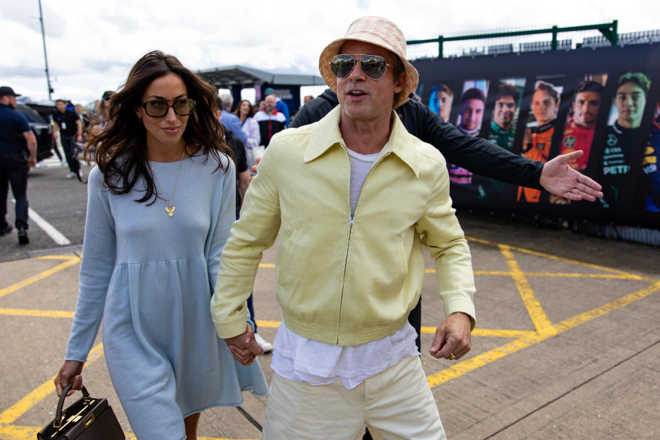 NORTHAMPTON, ENGLAND - JULY 7: Actor Brad Pitt and girlfriend Ines De Ramon walk in the paddock during the F1 Grand Prix of Great Britain at Silverstone Circuit on July 7, 2024 in Northampton, United Kingdom. (Photo by Kym Illman/Getty Images)
