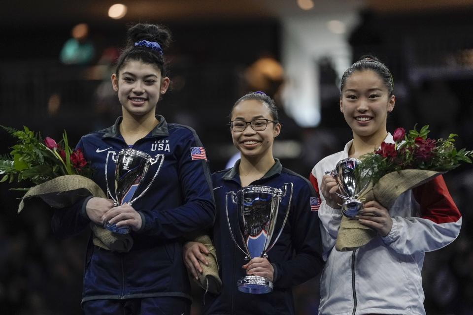First place all around winner Morgan Hurd of the United States is flanked by second place winner Kayla DiCello of the United States and third place winner Hitomi Hatakeda of Japan after the America Cup gymnastics competition Saturday, March 7, 2020, in Milwaukee. (AP Photo/Morry Gash)