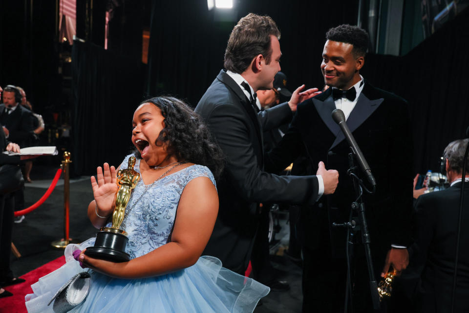 Film subject Porché Brinker, and directors Ben Proudfoot and Kris Bowers back stage during the 96th Annual Academy Awards.