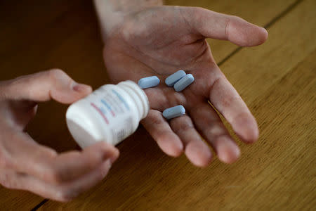 Will Nutland, who supports a drug-buying network and takes generic drugs himself to prevent HIV infection, shows off some of his generic drugs during an interview with Reuters at his home in central London, Britain November 3, 2016. REUTERS/Dylan Martinez