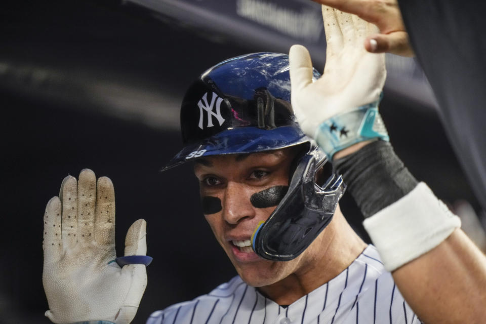 New York Yankees' Aaron Judge celebrates with teammates after hitting a grand slam against the Washingtin Nationals during the second inning of a baseball game Wednesday, Aug. 23, 2023, in New York. (AP Photo/Frank Franklin II)