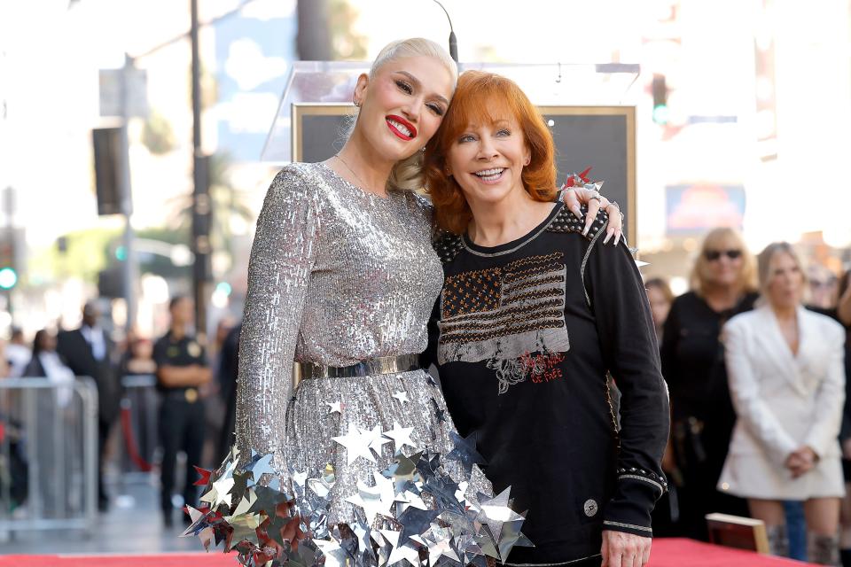 Gwen Stefani poses with fellow "The Voice" coach Reba McEntire during Stefani's Hollywood Walk of Fame Star Ceremony on Oct. 19, 2023.