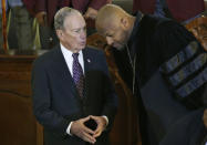 Democratic Presidential candidate Michael Bloomberg, left, talks with the Rev. Robert Turner, right, during a service at the Vernon American Methodist Episcopal Church in Tulsa, Okla., Sunday, Jan. 19, 2020. (AP Photo/Sue Ogrocki)