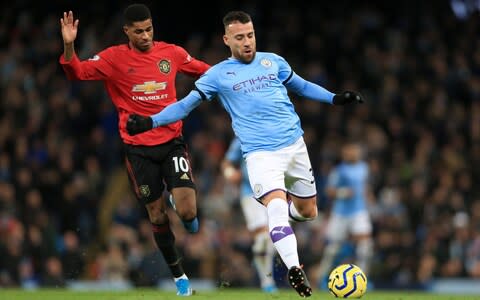 Marcus Rashford of Man Utd battles with Nicolas Otamendi of Man City during the Premier League match between Manchester City and Manchester United at the Etihad Stadium on December 7, 2019 in Manchester, United Kingdom - Credit: Offside