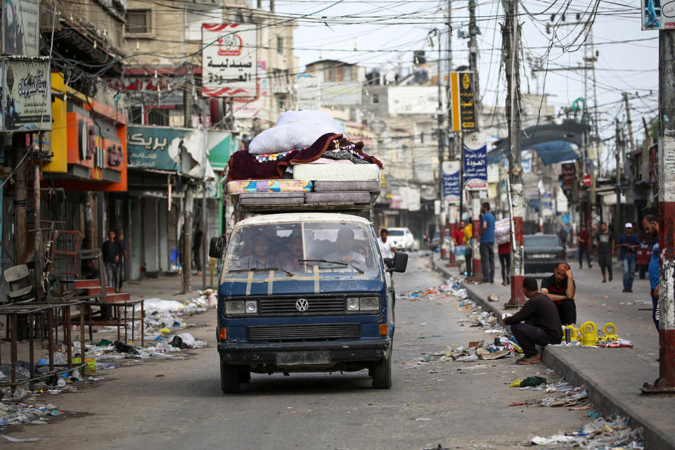 Palestinians transport their belongings on the back of a van as they flee Rafah on Saturday. (Getty Images / (Photo by AFP) (Photo by -/AFP via Getty Images))