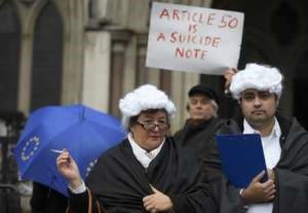 Demonstrators stand outside the High Court during a legal challenge to force the British government to seek parliamentary approval before starting the formal process of leaving the European Union, in London, Britain, October 13, 2016. REUTERS/Toby Melville