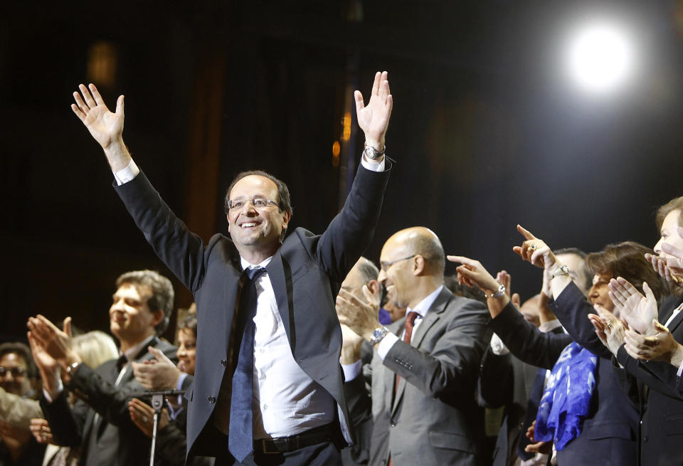 French president-elect Francois Hollande waves to crowds gathered to celebrate his election victory in Bastille Square in Paris, Sunday, May 6, 2012. Hollande defeated outgoing President Nicolas Sarkozy on Sunday to become France's next president, Sarkozy conceded defeat minutes after the polls closed. (AP Photo/Laurent Cipriani)
