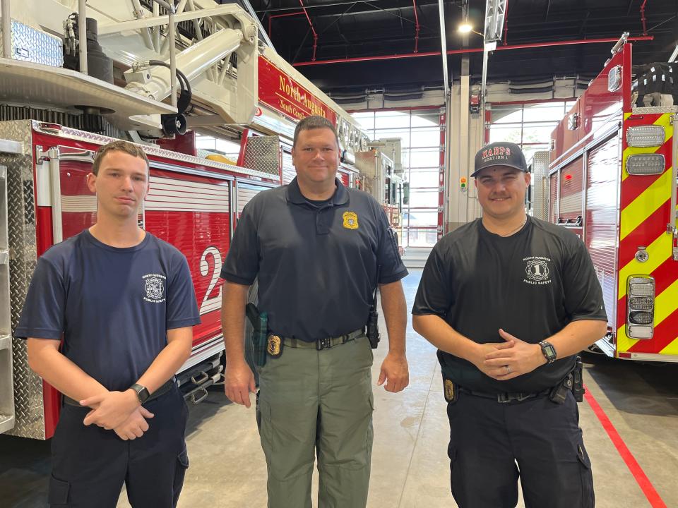 (Left to right) North Augusta Firefighter James Newman III, Public Safety Spokesman Junior Johnson, and Fire Sgt. Daniel Smith pose for a photograph inside the bays of the new Fire Station #1 at 311 West Martintown Rd. in North Augusta, SC on November 1, 2022.