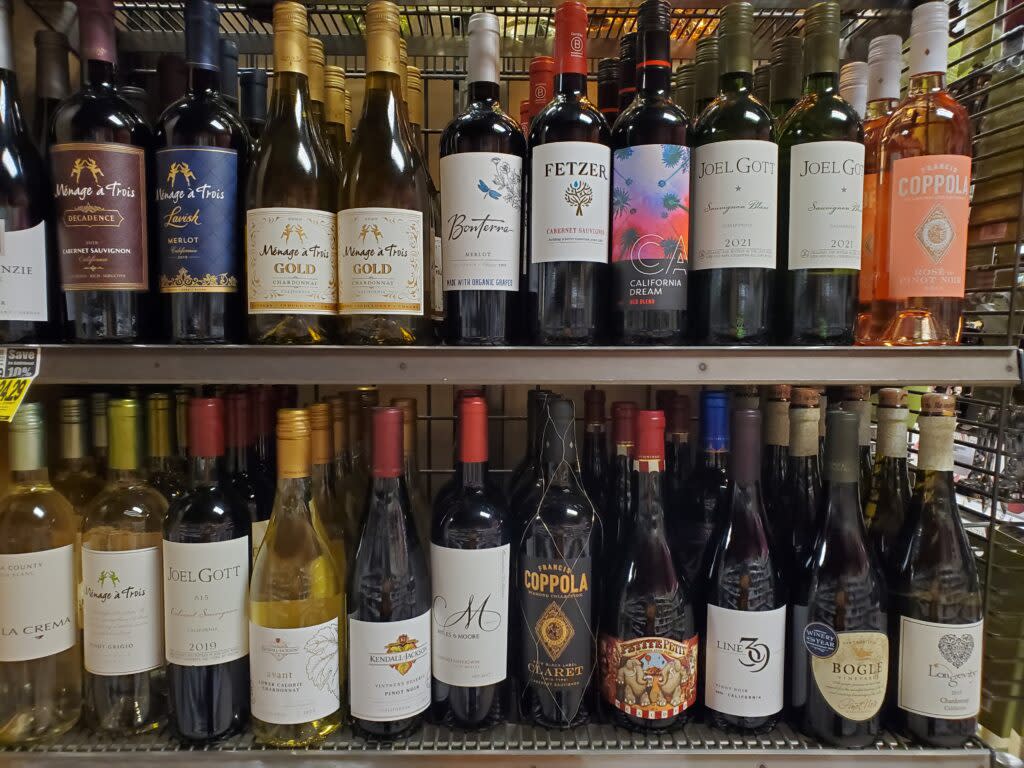 Bottles of wine line shelves at a Fred Meyer grocery store in Anchorage on June 29, 2022. (Photo by Yereth Rosen/Alaska Beacon)