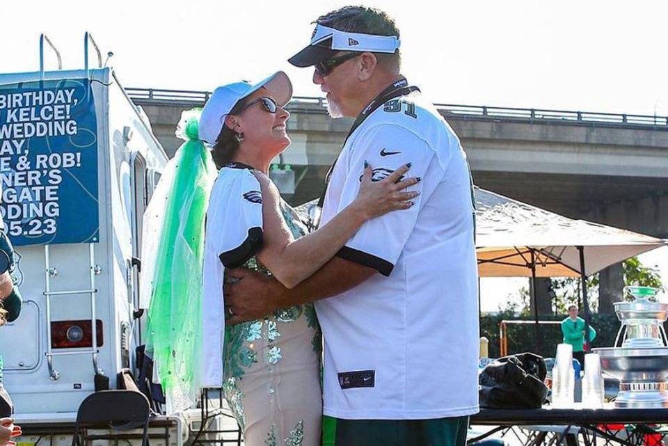 <p>Philadelphia Eagles/Instagram</p> Philadelphia Eagles superfans Brooke and Rob Rittner tie the knot at an Eagles tailgate on Sunday. 