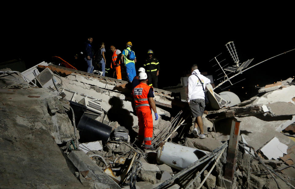 <p>Rescue workers check a collapsed house after an earthquake hits the island of Ischia, off the coast of Naples, Italy, Aug. 22, 2017. (Photo: Ciro De Luca/Reuters) </p>