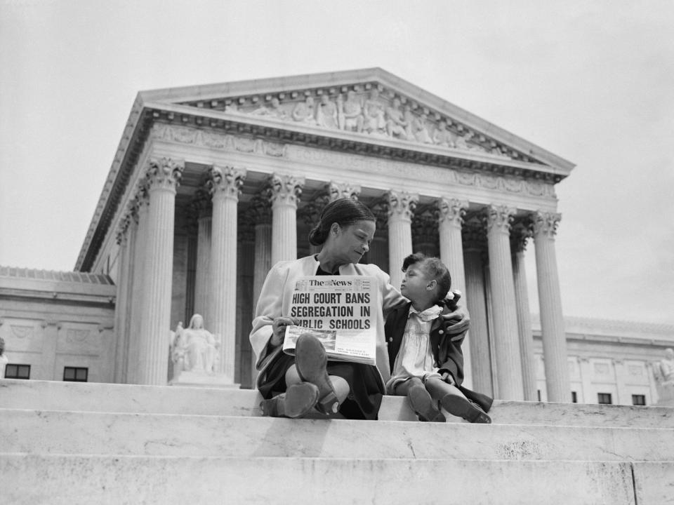 Nettie Hunt and her daughter Nickie sit on the steps of the U.S. Supreme Court. Nettie explains to her daughter the meaning of the high court's ruling in the Brown Vs. Board of Education case that segregation in public schools is unconstitutional.