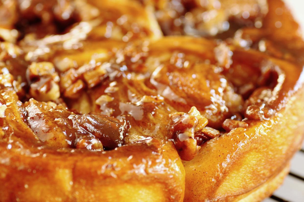 caramel pecan sticky buns on a wire rack