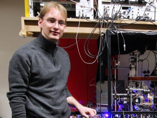 Physicist Jerome Lodewyck is pictured next to an atomic optic clock on March 19, 2009 in Paris. Physicists said Tuesday that a so-called optical lattice clock, touted by some as the time-measuring device of the future, had passed a key accuracy test