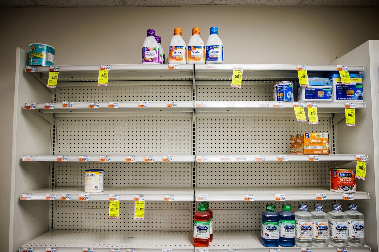 Shelves normally meant for baby formula sit nearly empty at a store in downtown Washington, DC, on May 22, 2022. - A US military plane bringing several tons of much-needed baby formula from Germany landed on May 22, 2022, at an airport in Indiana as authorities scramble to address a critical shortage. (Photo by Samuel Corum / AFP) (Photo by SAMUEL CORUM/AFP via Getty Images)