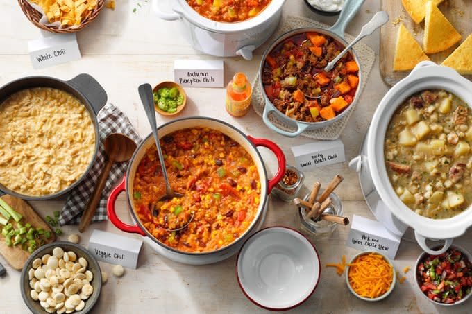 different types of chili in pots on a white table