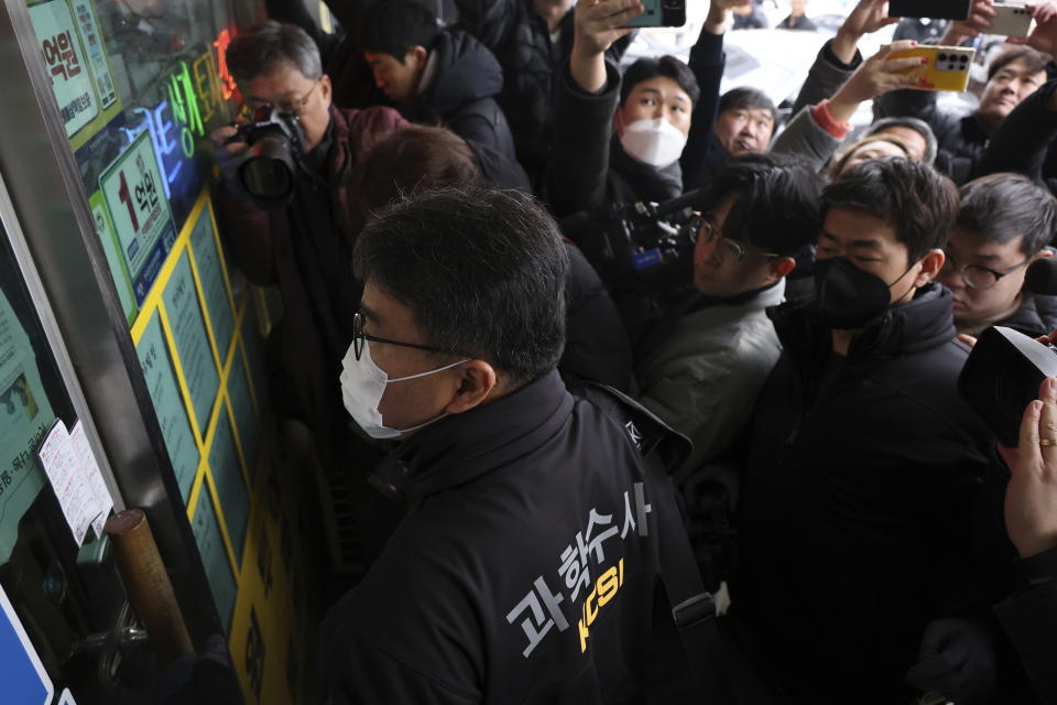 South Korea police arrives for seize materials at the office of the man who stabbed opposition leader Lee Jae-myung, in Asan, South Korea, Wednesday, Jan. 3, 2024. South Korean police on Wednesday raided the residence and office of a man who stabbed the country’s opposition leader, Lee Jae-myung, in the neck in an attack that left him hospitalized in an intensive care unit, officials said. (Lee Ju-hyung/Yonhap via AP)