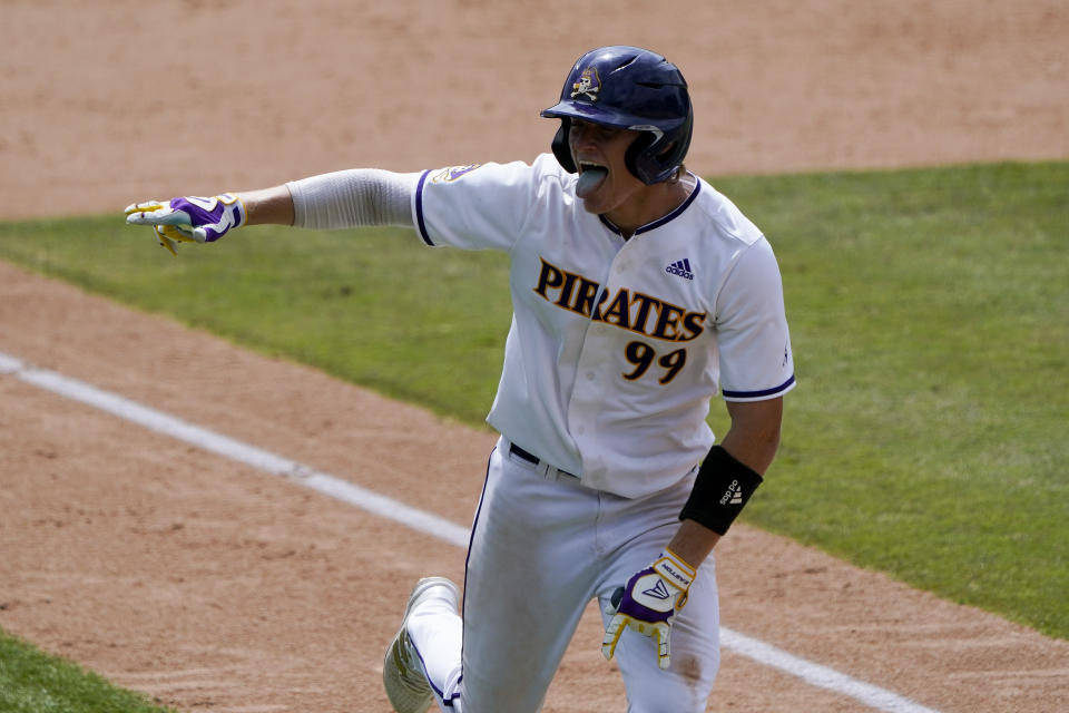 East Carolina's Alec Makarewicz celebrates his home run against Texas during the eighth inning of an NCAA college super regional baseball game Friday, June 10, 2022, in Greenville, N.C. (AP Photo/Chris Carlson)