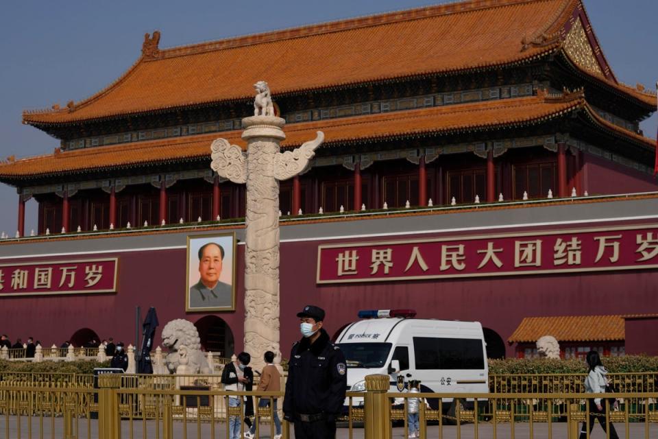 Chinese security personnel guard Tiananmen Gate near the Great Hall of the People (AP)