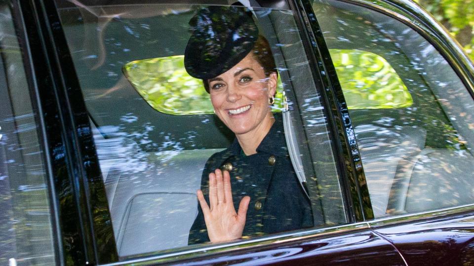 Catherine, then-Duchess of Cambridge waves while she is driven to Crathie Kirk Church before the service on August 25, 2019 in Crathie, Aberdeenshire.