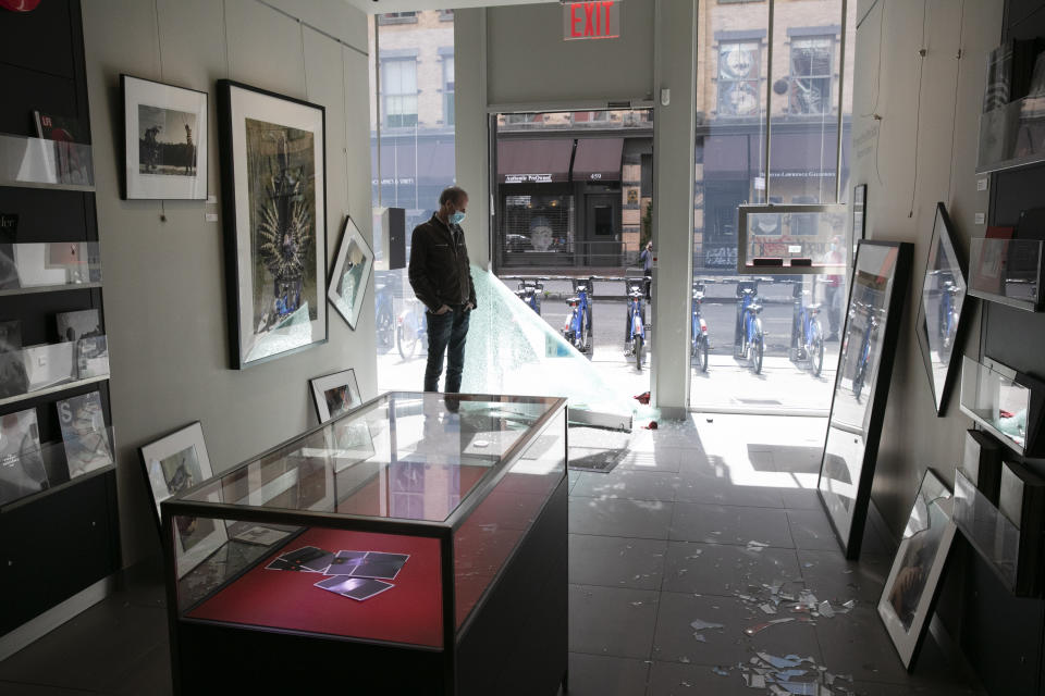 Elliot Kurland, owner of the Leica Gallery New York, stands in the front of his store, Monday, June 1, 2020, in the SoHo neighbourhood of New York. Protesters broke into the camera store Sunday night, stealing expensive camera equipment, in reaction to George Floyd's death while in police custody on May 25 in Minneapolis. (AP Photo/Mark Lennihan)