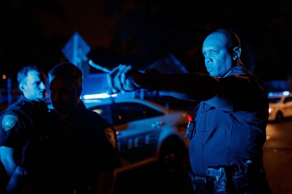 Tallahassee Police Department Sgt. Damon Miller directs an officer to check surrounding homes for doorbell cameras while investigating the scene of a shooting on Keith Street in Tallahassee, Fla. on Wednesday, March 16, 2022. 