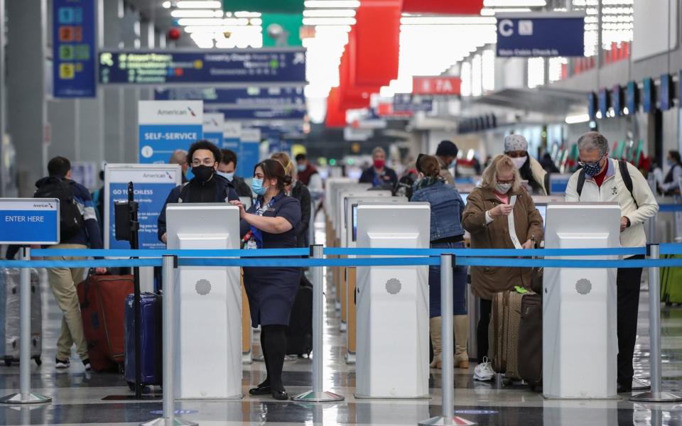 Travellers at O'Hare International Airport ahead of the Thanksgiving holiday in Chicago - Reuters