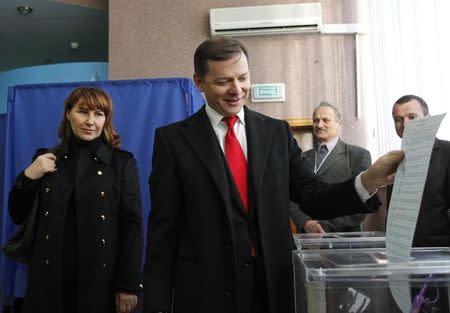 Oleh Lyashko, head of the Radical Party, casts a ballot as he visits a polling station during a parliamentary election in Kiev, October 26, 2014. REUTERS/Valentyn Ogirenko