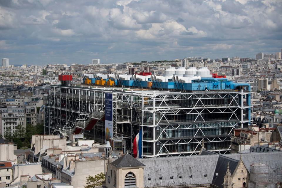 A view of the bright colorful forms of the Centre Georges Pompidou is seen rising above the Paris skyline