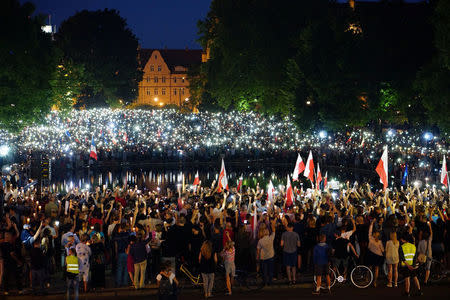 People attend a protest against the Supreme Court legislation in Poznan, Poland, July 21, 2017. Agencja Gazeta/Lukasz Cynalewski via REUTERS