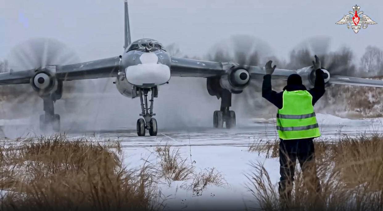 a Tu-95 strategic bomber of the Russian air force taxis before takeoff for a joint air patrol with Chinese bombers at an airbase in an unspecified location in Russia.