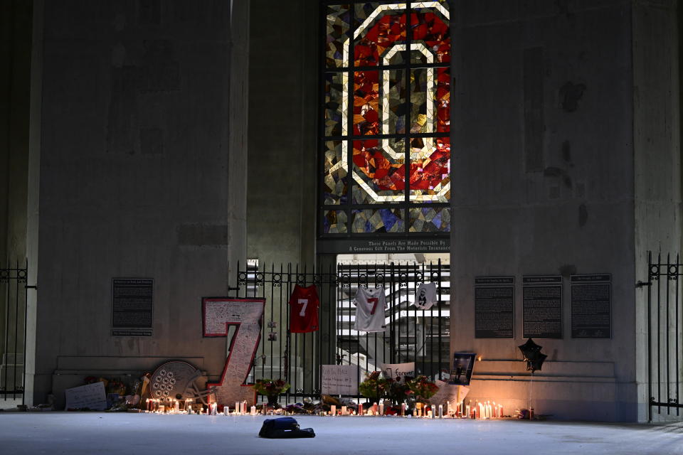 COLUMBUS, OHIO - APRIL 12: Flowers, lit candles and messages are left outside Ohio Stadium during a candlelight vigil in memory of Dwayne Haskins on April 12, 2022 in Columbus, Ohio. Pittsburgh Steelers quarterback and former Ohio State Buckeye Dwayne Haskins, 24, died Saturday morning after he was struck by a dump truck while walking on a South Florida highway. (Photo by Gaelen Morse/Getty Images)