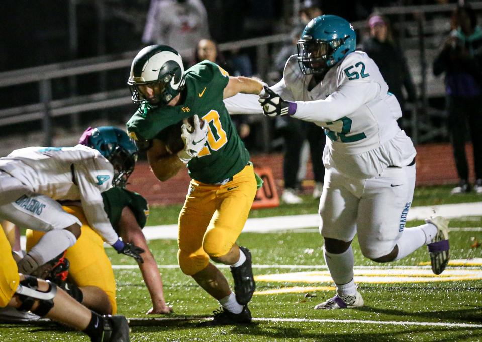 Flat Rock's Brian Booms,runs for one of his 32 touchdowns this eason.