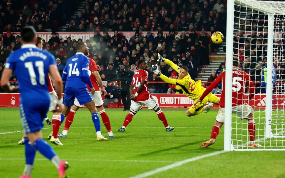 Everton's Dwight McNeil scores their first goal past Nottingham Forest's Odysseas Vlachodimos