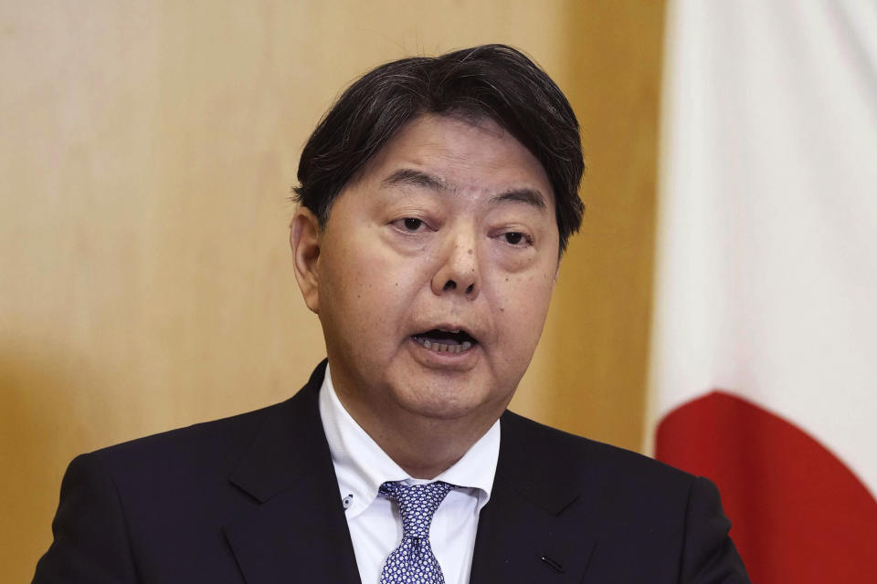 Japanese Foreign Minister Yoshimasa Hayashi answers to reporters' questions after meeting with his counterpart Qin Gang, at Japanese Embassy in Beijing Sunday, April 2, 2023. (Kyodo News via AP)