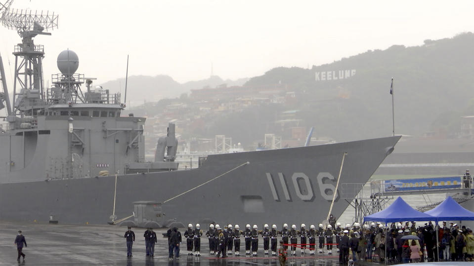 In this image from a video, sailors and marines stand guard in front of Taiwan’s guided-missile frigate at naval base in the northern port of Keelung, Taiwan Monday, March 8, 2021. Taiwanese President Tsai Ing-wen visited the naval base on Monday to thank sailors and marines for their dedication to protecting the island amid renewed threats from China, vowing not to allow the loss of “any single inch" of territory. (AP Photo/Johnson Lai)