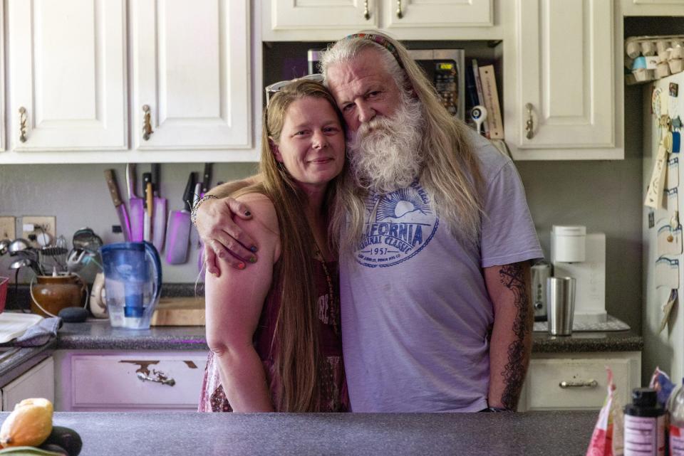 Tim and Crystal Dotson in the kitchen of their home in Corinth.