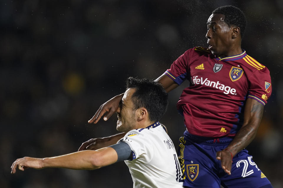 Real Salt Lake midfielder Anderson Julio, right, jumps for the ball against LA Galaxy defender Maya Yoshida during the first half of an MLS soccer match Saturday, Oct. 14, 2023, in Carson, Calif. (AP Photo/Ryan Sun)