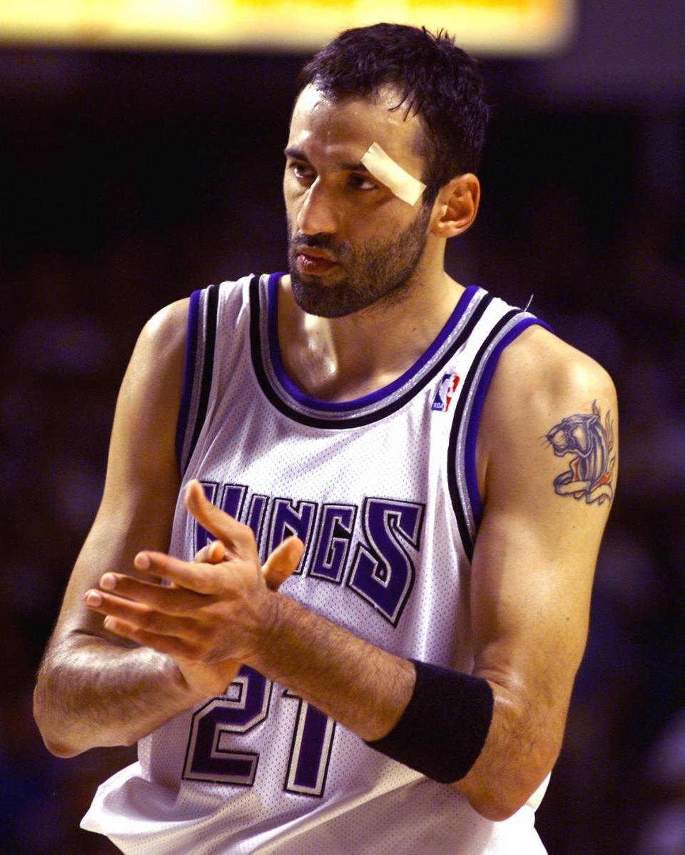 The Sacramento Kings’ Vlade Divac claps after a play during Game 3 of the first-round playoff series against the Utah Jazz on May 12, 1999.